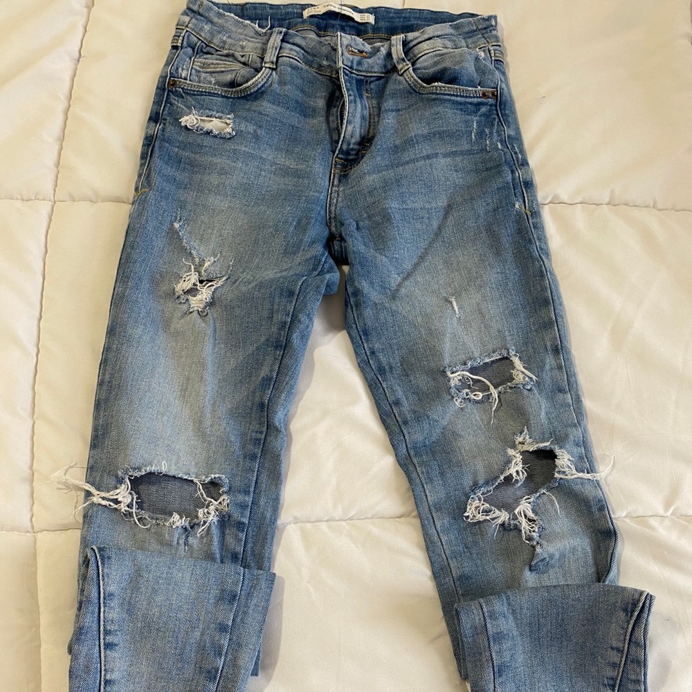 Distressed blue jeans. Size 2